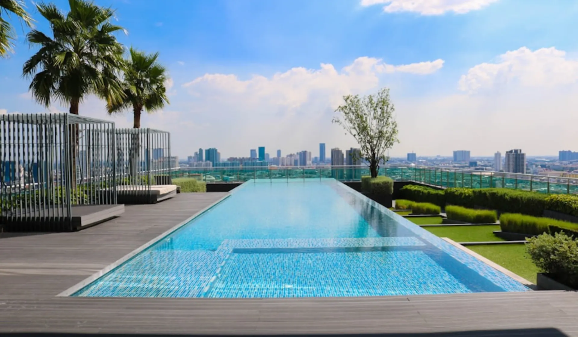 San Diego homeowner browsing pool builder websites on a laptop at home, illustrating the research-heavy decision process that effective pool marketing in San Diego needs to intercept early and consistently